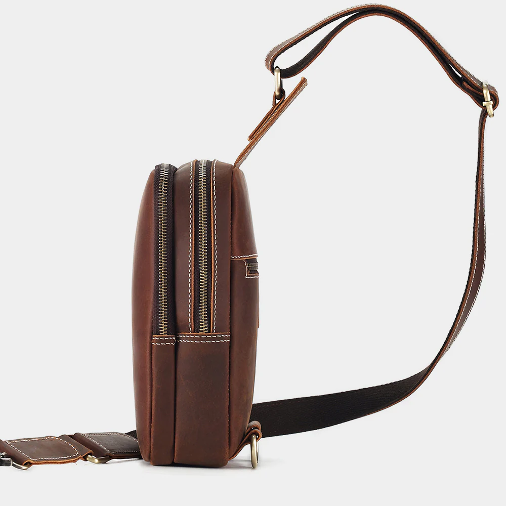 The Blaze leather sling bag side profile with twin zippers