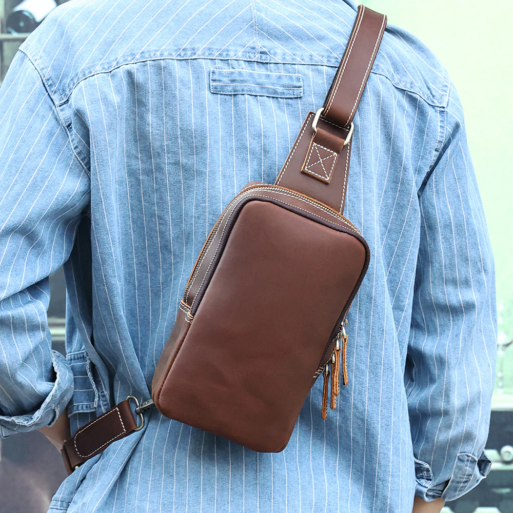 The Blaze leather sling bag worn across the back