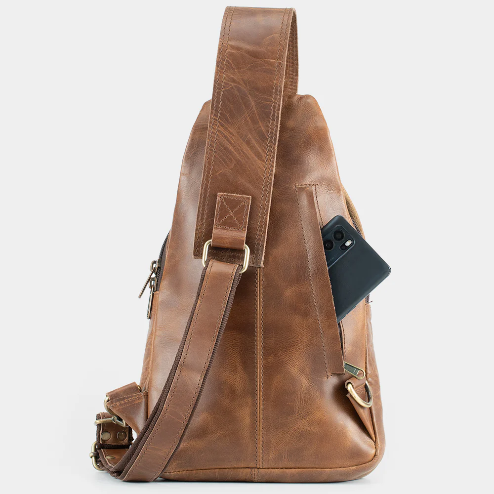 The Cross rear zip pocket holding a phone