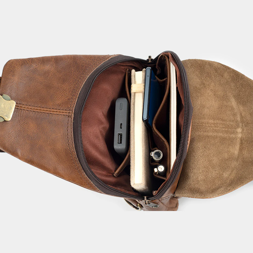 The Cross packed with a notebook, phone and power bank