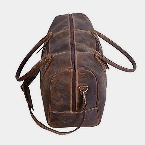 Side view of The Coarse duffle showing the end pocket and strap