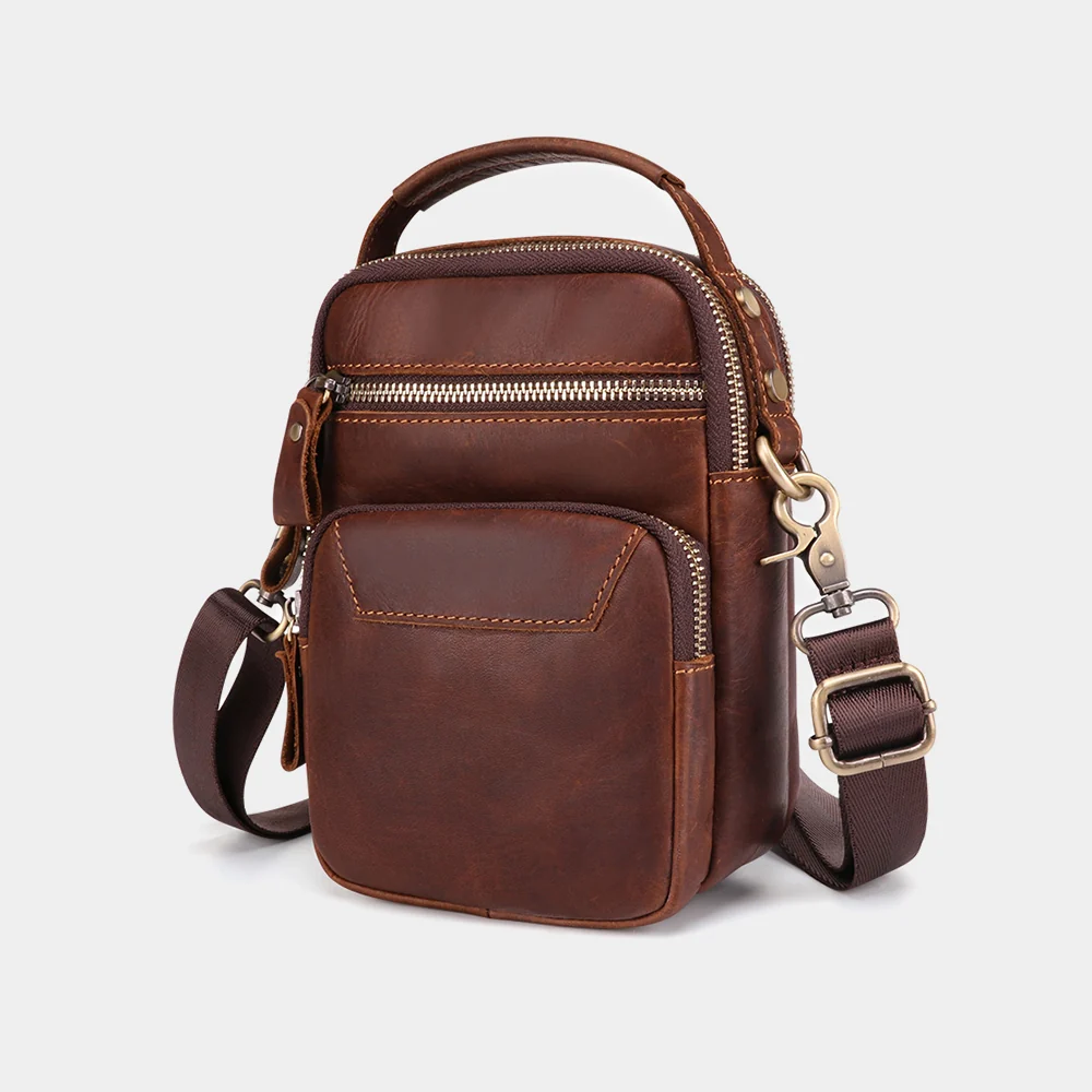 The Estro leather sling bag, three-quarter view with strap