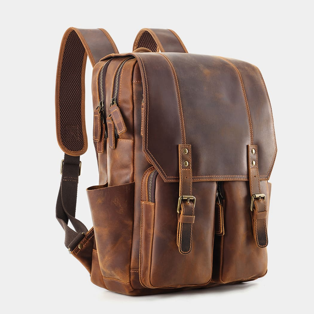 The Compact leather backpack at a three-quarter angle
