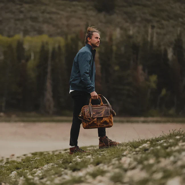 The Pilot leather briefcase carried on a mountain roadside