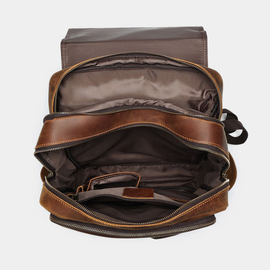 The Compact backpack open, showing lined interior compartments