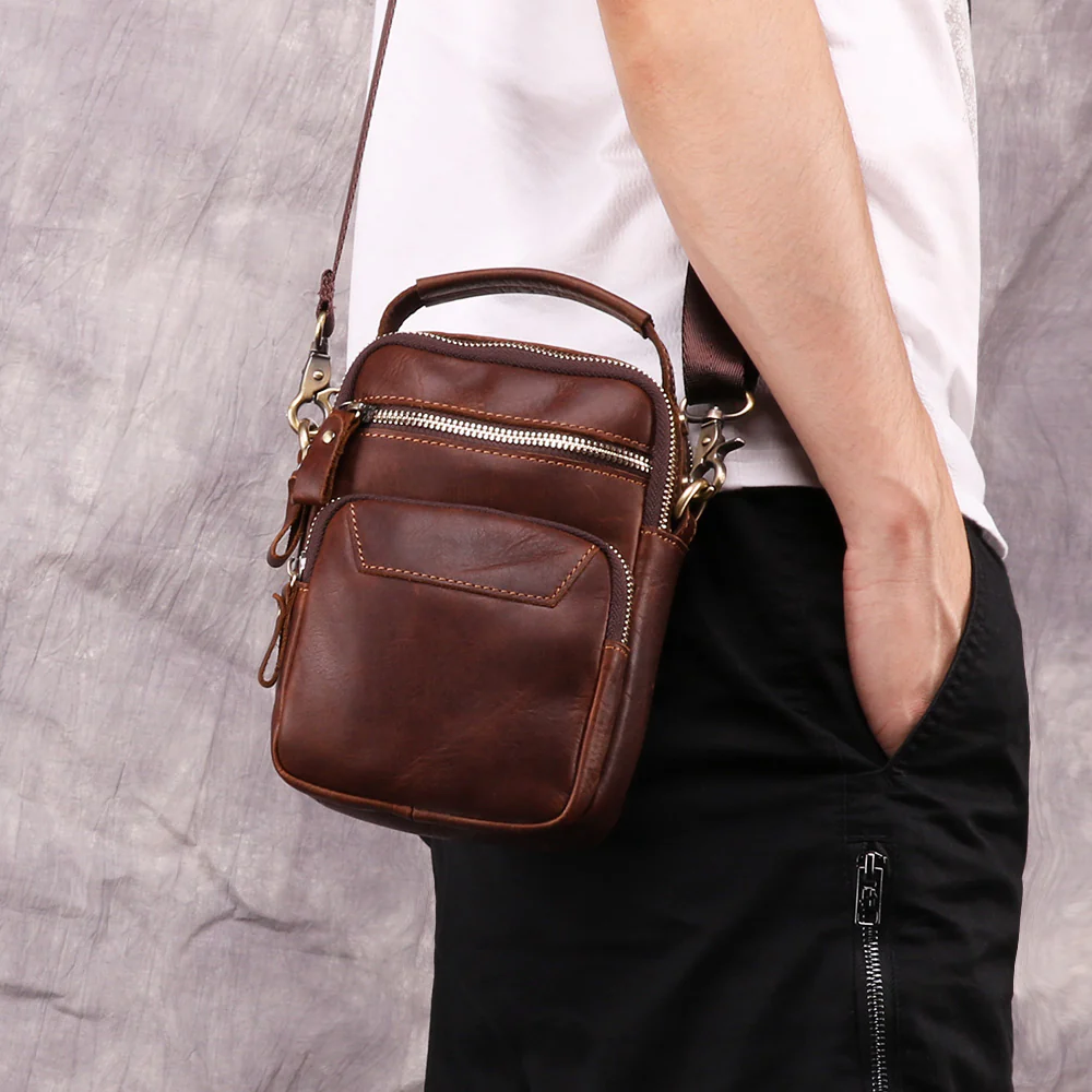 The Estro leather sling bag worn crossbody