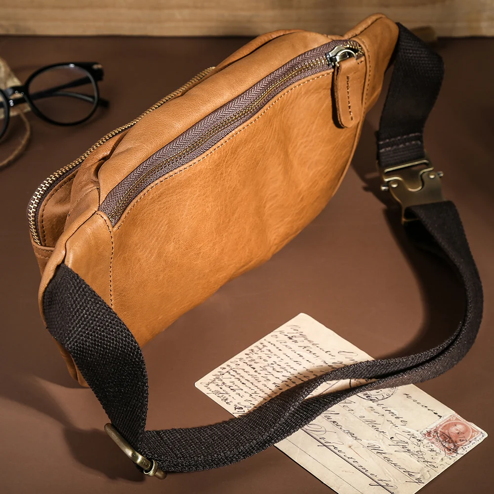 The Alpha leather fanny pack styled with travel keepsakes