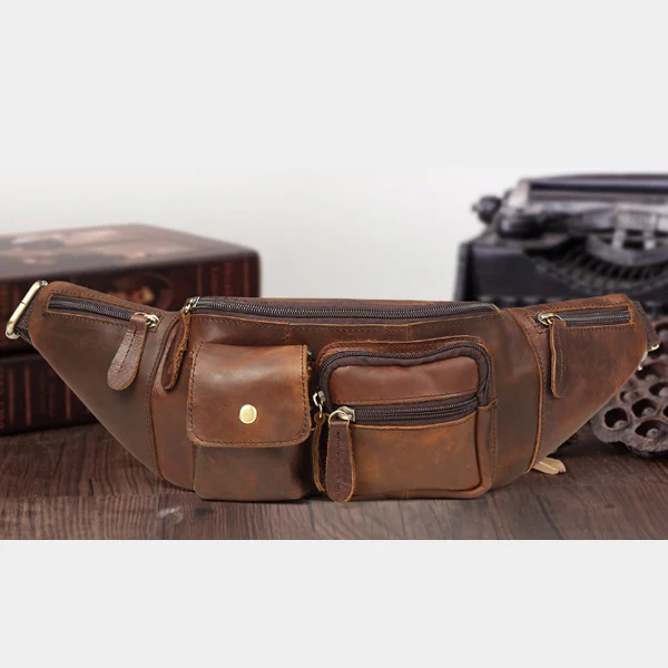 The Fanny Pack leather belt bag styled on a wooden desk