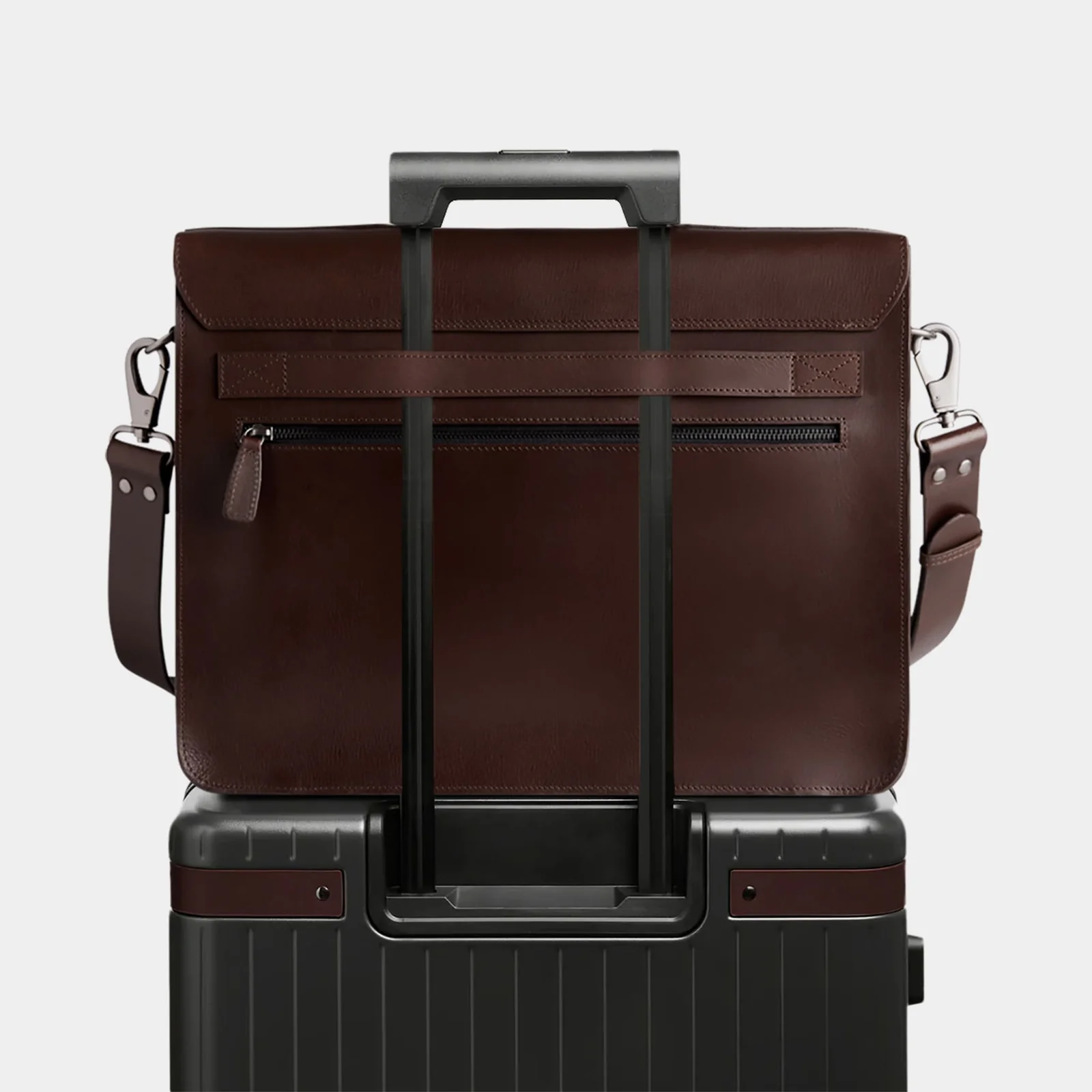 The Heritage on a carry-on suitcase using the rear luggage strap
