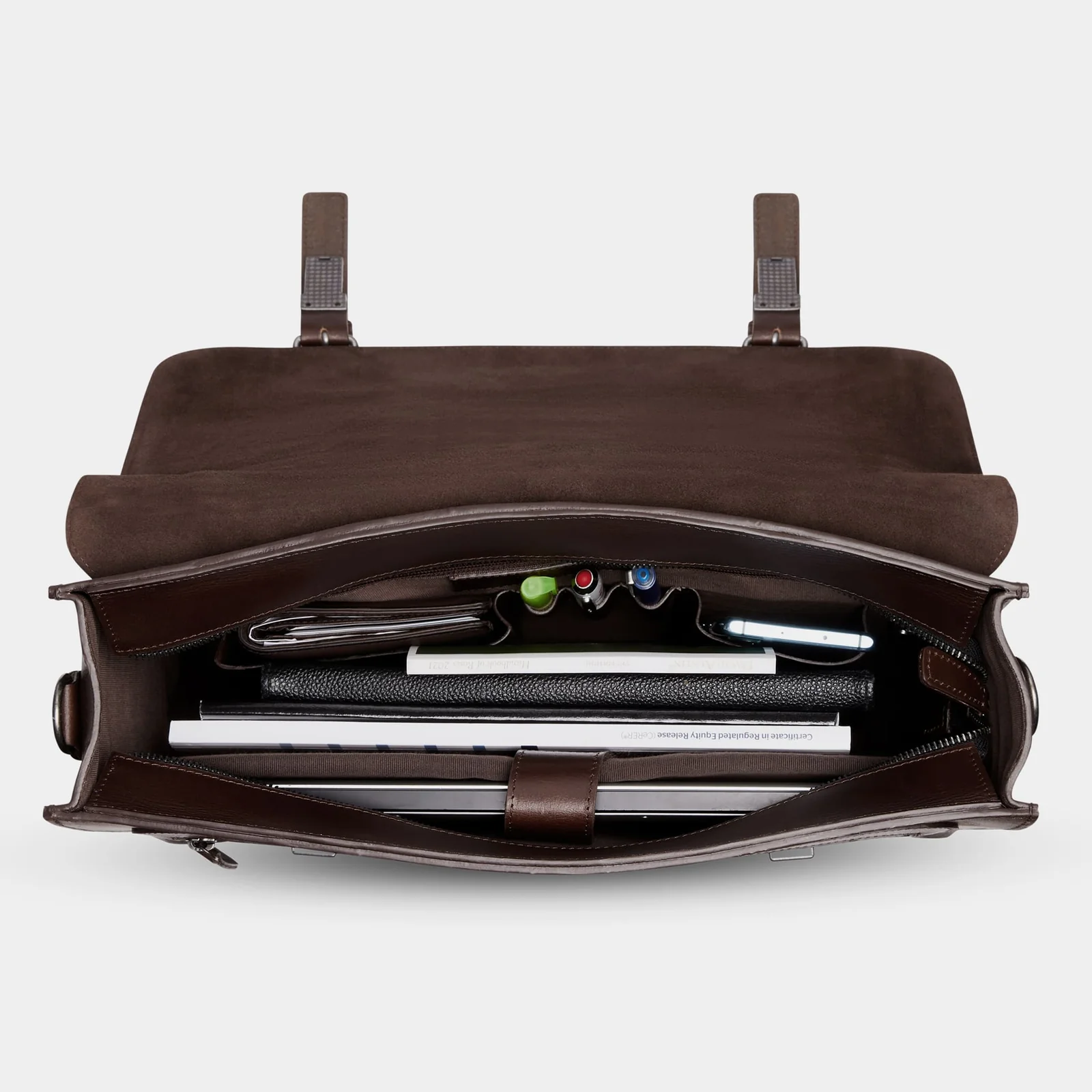 The Heritage packed with a laptop, notebook and pens