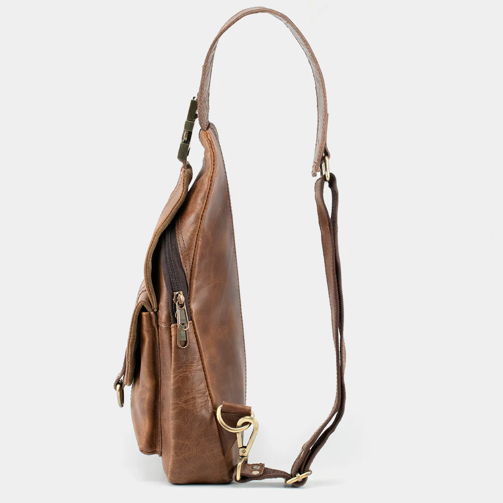 The Cross leather sling bag side profile with adjustable strap