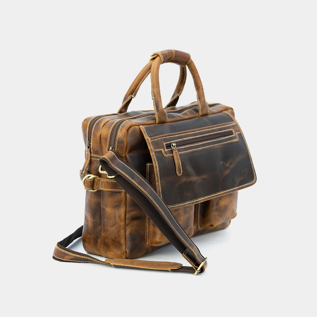 The Pilot leather briefcase at a three-quarter angle with strap