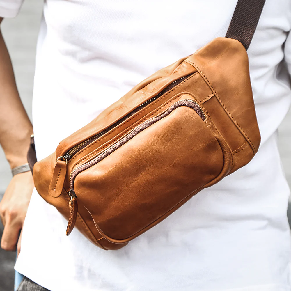 The Alpha tan leather fanny pack worn crossbody