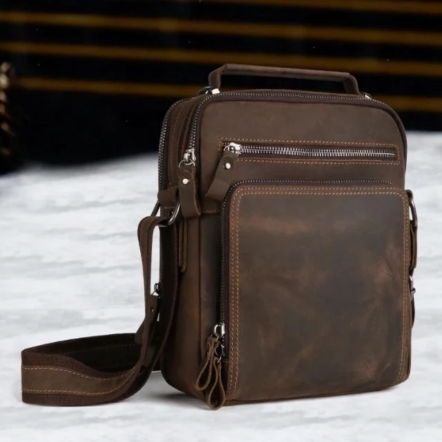 The Man Bag leather sling bag at a three-quarter angle